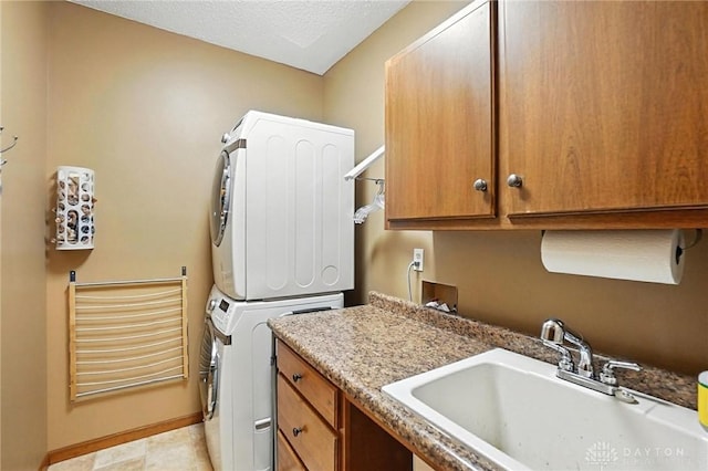 1101 Fox Chase Ct, Centerville, OH 45459 - laundry room featuring stacked washing machine and dryer and cabinet space