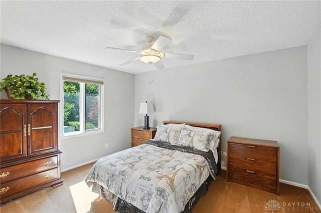 1101 Fox Chase Ct, Centerville, OH 45459 - bedroom with a textured ceiling, light carpet, and a ceiling fan