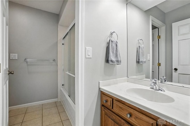 1101 Fox Chase Ct, Centerville, OH 45459 - full bath featuring vanity, tile patterned floors, and bath / shower combo with glass door