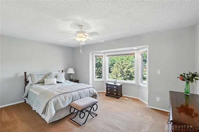 1101 Fox Chase Ct, Centerville, OH 45459 - bedroom featuring carpet, a ceiling fan, and a textured ceiling