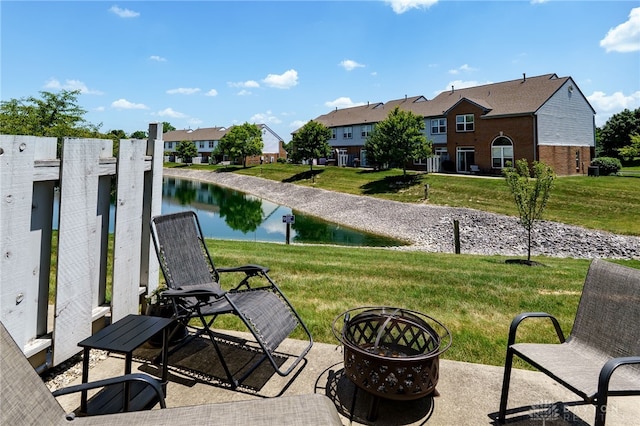9270 Great Lakes Cir Unit 9270, Washington Twp, OH 45458 - view of patio / terrace with a fire pit, a residential view, and a water view