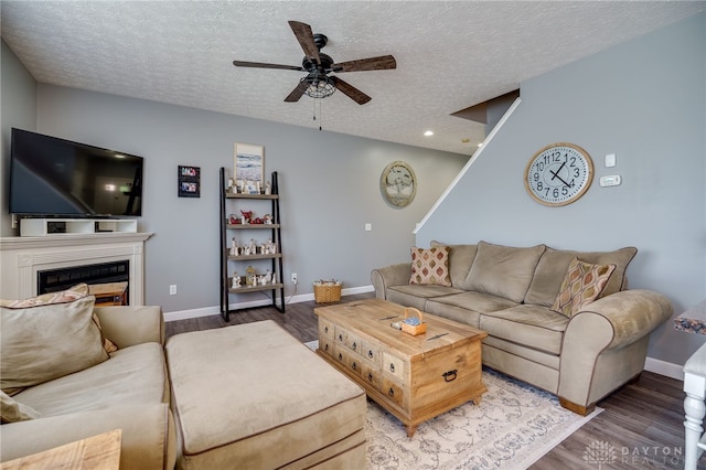9270 Great Lakes Cir Unit 9270, Washington Twp, OH 45458 - living room with a ceiling fan, a textured ceiling, wood finished floors, a fireplace, and recessed lighting