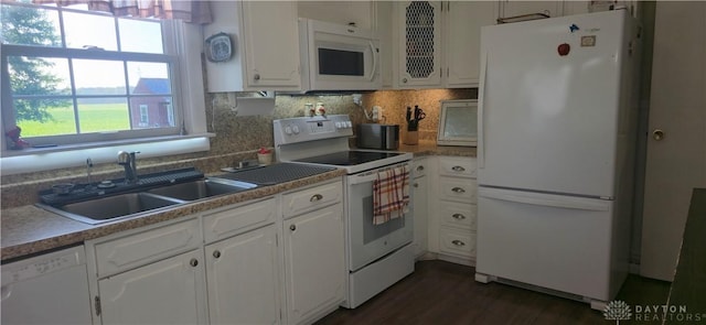 8320 N State Route 589, Fletcher, OH 45326 - kitchen with white appliances, white cabinetry, dark wood-type flooring, and tasteful backsplash