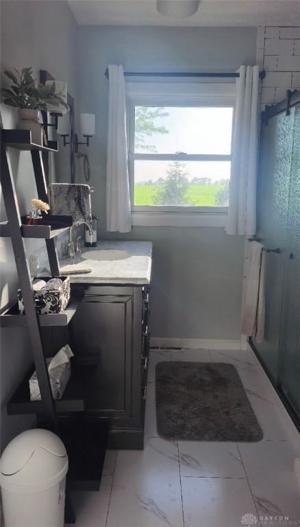 8320 N State Route 589, Fletcher, OH 45326 - full bath featuring vanity, a stall shower, and marble finish flooring