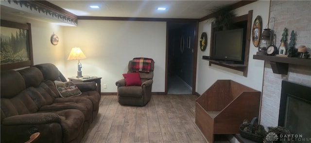 8320 N State Route 589, Fletcher, OH 45326 - living room featuring wood finished floors, a brick fireplace, and recessed lighting