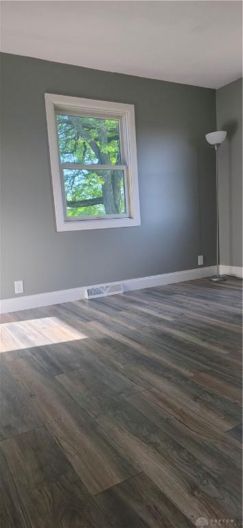 8320 N State Route 589, Fletcher, OH 45326 - empty room with dark wood finished floors and baseboards