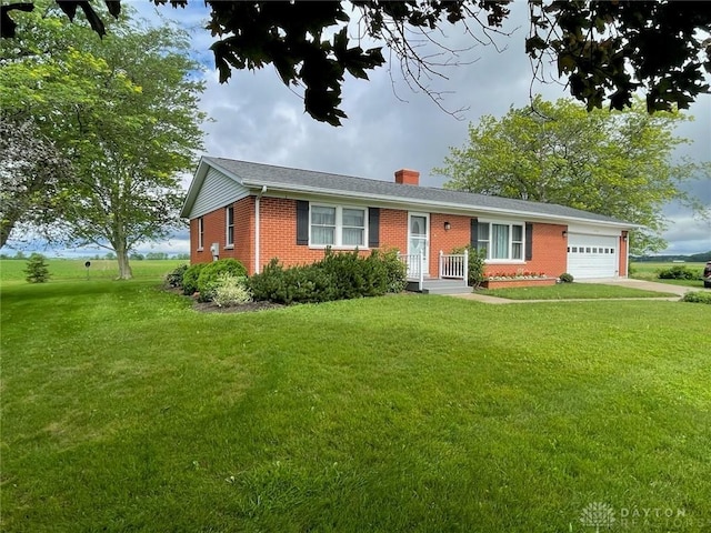8320 N State Route 589, Fletcher, OH 45326 - ranch-style home with brick siding, a chimney, a garage, and a front lawn