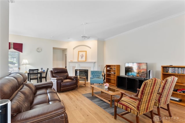 2396 Vienna Pkwy, Dayton, OH 45459 - living room featuring wood finished floors, crown molding, and a glass covered fireplace
