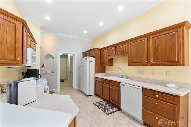 2396 Vienna Pkwy, Dayton, OH 45459 - kitchen featuring white appliances, crown molding, light countertops, brown cabinetry, and recessed lighting