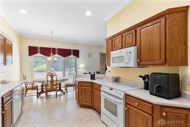 2396 Vienna Pkwy, Dayton, OH 45459 - kitchen with white appliances, brown cabinetry, ornamental molding, hanging light fixtures, and light countertops