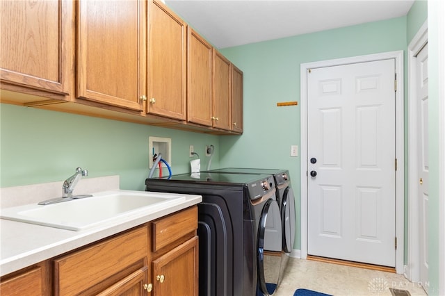 2396 Vienna Pkwy, Dayton, OH 45459 - washroom featuring cabinet space, washing machine and dryer, and light tile patterned flooring