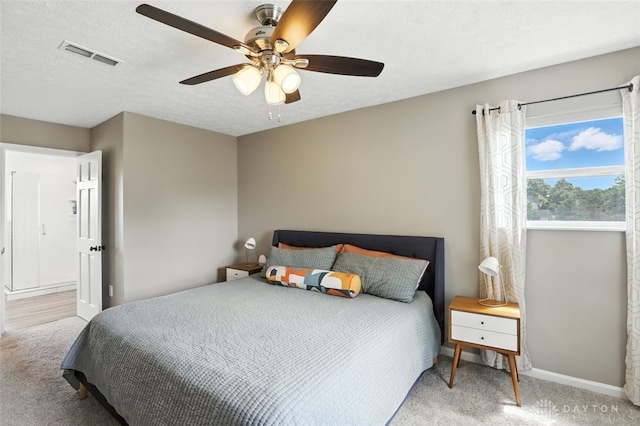 6630 Falling Leaves Ct, Mason, OH 45040 - carpeted bedroom featuring a ceiling fan and a textured ceiling