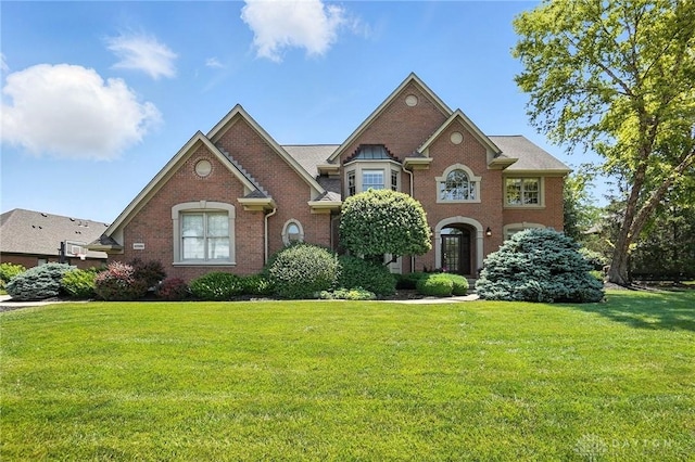 10598 Falls Creek Ln, Washington Twp, OH 45458 - colonial inspired home featuring brick siding and a front lawn