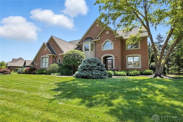 10598 Falls Creek Ln, Washington Twp, OH 45458 - colonial house with brick siding and a front lawn