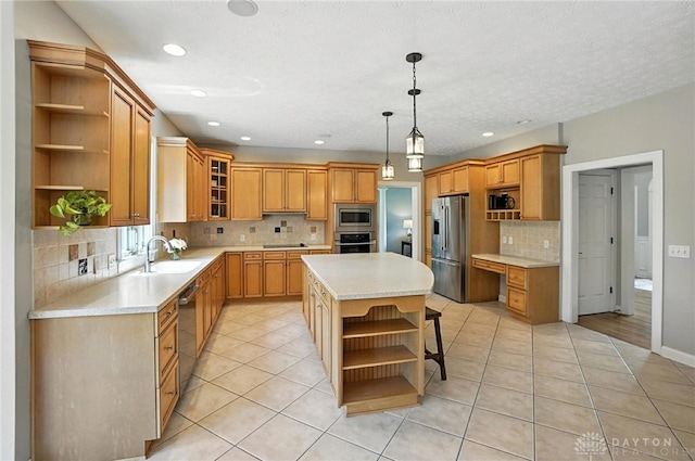10598 Falls Creek Ln, Washington Twp, OH 45458 - kitchen with open shelves, appliances with stainless steel finishes, decorative backsplash, light countertops, and a kitchen island