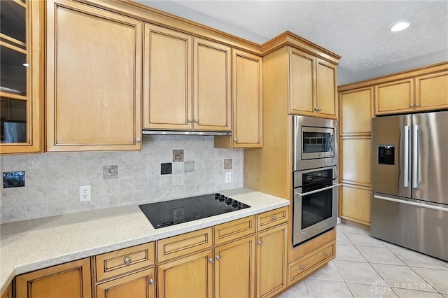 10598 Falls Creek Ln, Washington Twp, OH 45458 - kitchen with appliances with stainless steel finishes, light countertops, decorative backsplash, and recessed lighting