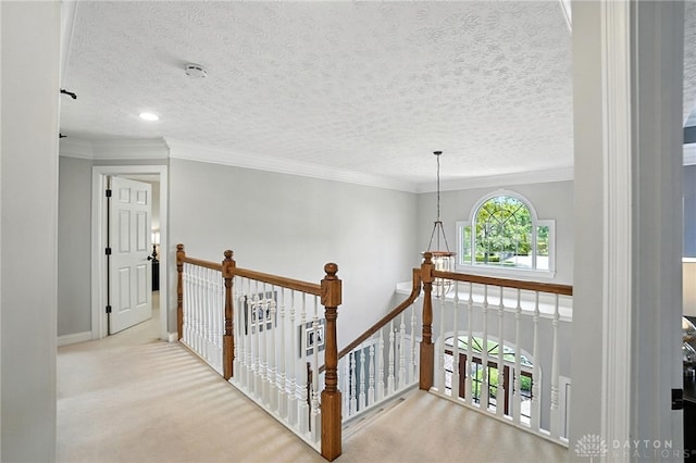 10598 Falls Creek Ln, Washington Twp, OH 45458 - hallway with an upstairs landing, carpet flooring, a textured ceiling, crown molding, and recessed lighting