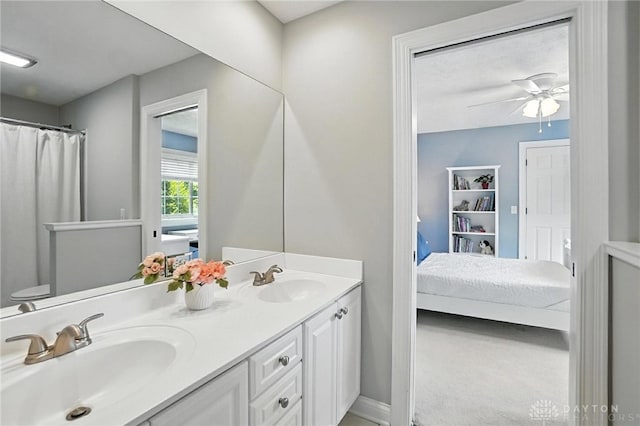 10598 Falls Creek Ln, Washington Twp, OH 45458 - bathroom with double vanity, ensuite bath, and ceiling fan