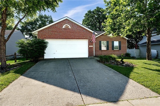 162 Choctaw Cir, Franklin, OH 45005 - view of front facade featuring driveway, a garage, and brick siding