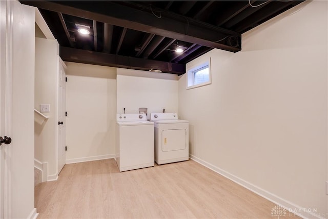 162 Choctaw Cir, Franklin, OH 45005 - laundry area with light wood-style floors and washing machine and dryer