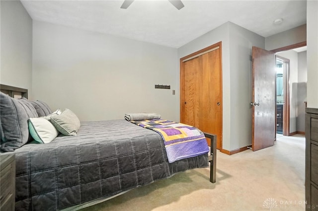 1778 Kensington Dr, Bellbrook, OH 45305 - bedroom featuring light colored carpet, a closet, and ceiling fan