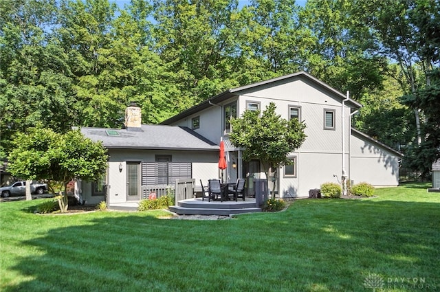 1778 Kensington Dr, Bellbrook, OH 45305 - back of property featuring a lawn and a chimney