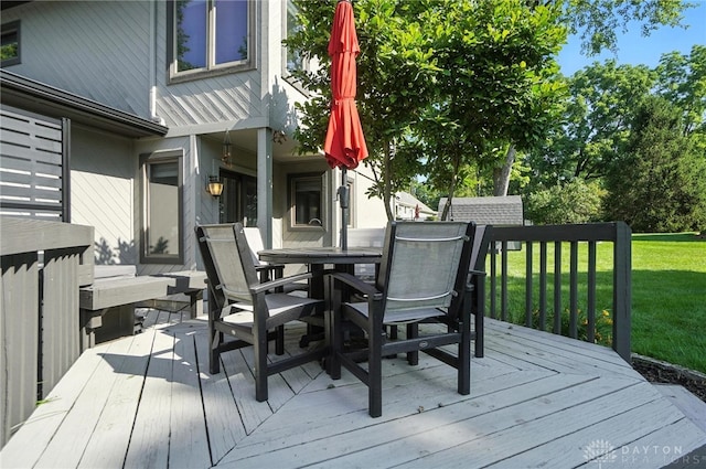 1778 Kensington Dr, Bellbrook, OH 45305 - deck with outdoor dining area and a lawn