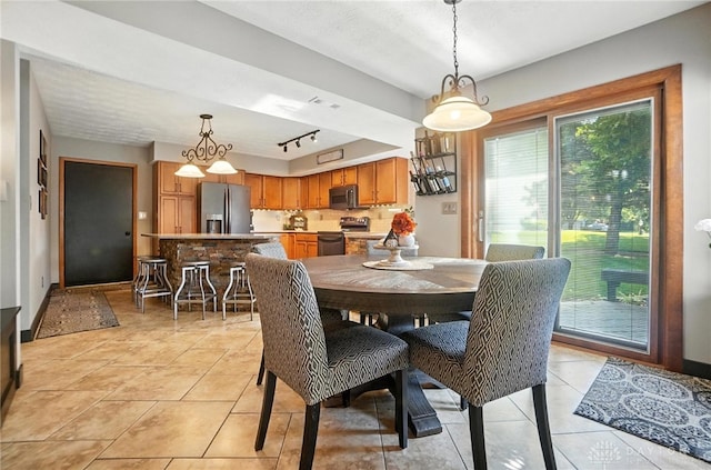 1778 Kensington Dr, Bellbrook, OH 45305 - dining room with light tile patterned flooring and rail lighting