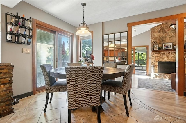 1778 Kensington Dr, Bellbrook, OH 45305 - dining area with a stone fireplace and light tile patterned flooring