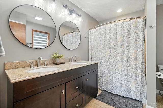 1778 Kensington Dr, Bellbrook, OH 45305 - bathroom featuring double vanity, tile patterned flooring, and a shower with shower curtain