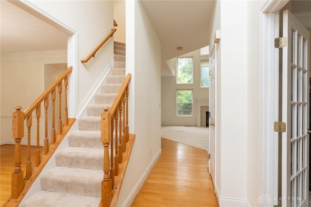 2540 Early Spring Ct, Dayton, OH 45459 - stairway with wood finished floors and crown molding