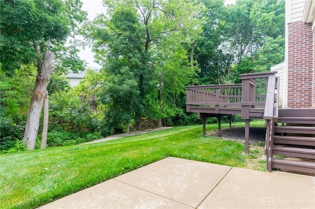 2540 Early Spring Ct, Dayton, OH 45459 - view of grassy yard with a patio, a deck, and view of scattered trees