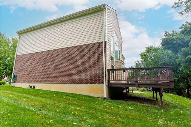 2540 Early Spring Ct, Dayton, OH 45459 - view of side of property with a deck, a lawn, and brick siding