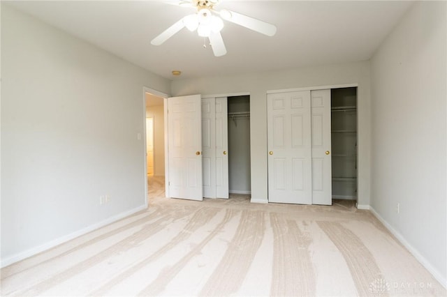 2540 Early Spring Ct, Dayton, OH 45459 - unfurnished bedroom with multiple closets, light carpet, and ceiling fan