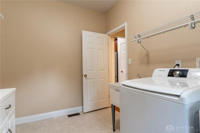 2540 Early Spring Ct, Dayton, OH 45459 - laundry area with washer / dryer and cabinet space