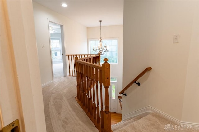 2540 Early Spring Ct, Dayton, OH 45459 - stairs with carpet, a chandelier, and recessed lighting