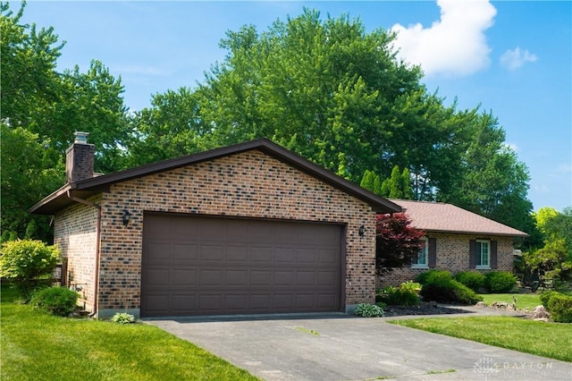 4425 E Entrada Dr, Beavercreek, OH 45431 - ranch-style house with brick siding, a chimney, a front lawn, and an attached garage
