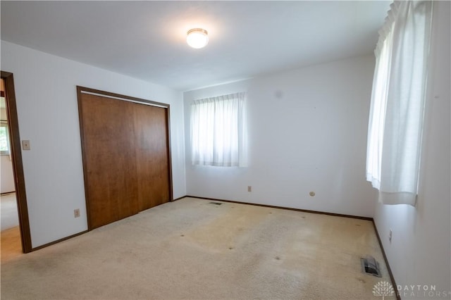 4425 E Entrada Dr, Beavercreek, OH 45431 - unfurnished bedroom featuring a closet and carpet flooring