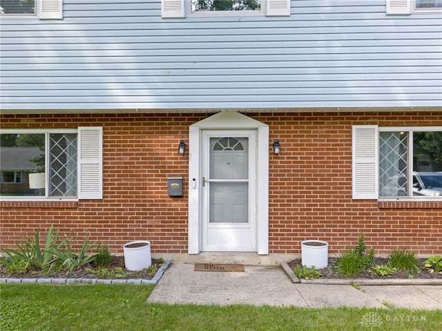 6118 Carnation Rd, Dayton, OH 45449 - doorway to property with brick siding