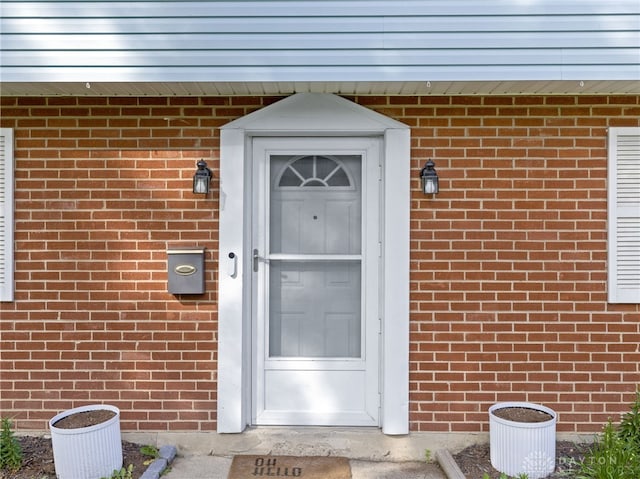 6118 Carnation Rd, Dayton, OH 45449 - view of exterior entry featuring brick siding