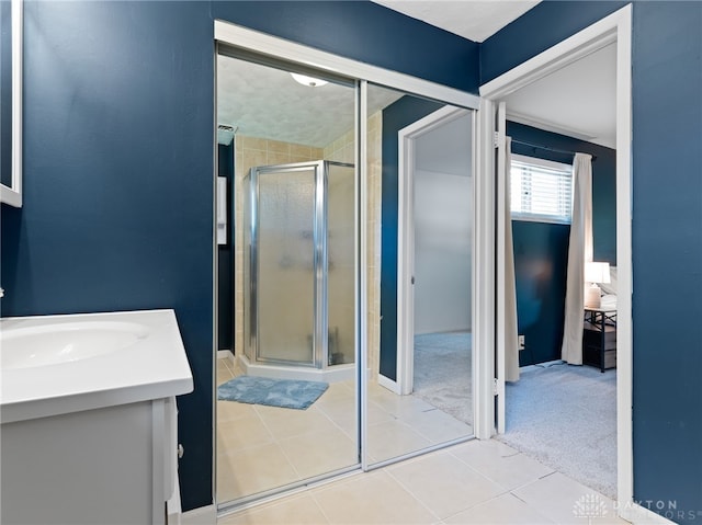 6118 Carnation Rd, Dayton, OH 45449 - bathroom with a shower stall, vanity, and tile patterned flooring