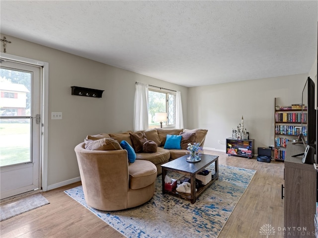 6118 Carnation Rd, Dayton, OH 45449 - living area featuring a textured ceiling and wood finished floors