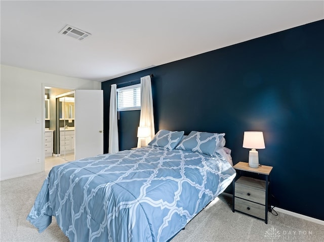 6118 Carnation Rd, Dayton, OH 45449 - carpeted bedroom featuring baseboards and ensuite bath
