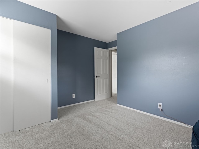 6118 Carnation Rd, Dayton, OH 45449 - unfurnished bedroom with carpet flooring and baseboards