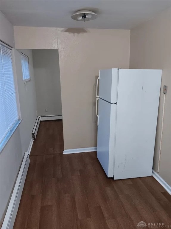 4129 E 3rd St Unit 4127, Dayton, OH 45403 - kitchen featuring freestanding refrigerator, baseboard heating, and wood finished floors