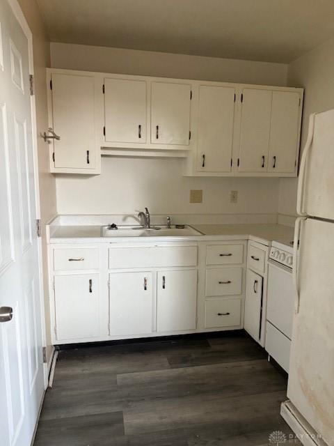 4129 E 3rd St Unit 4127, Dayton, OH 45403 - kitchen with freestanding refrigerator, white cabinets, stove, and light countertops