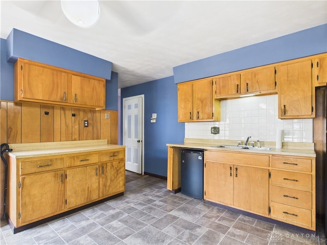 2120 Wyoming St, Dayton, OH 45410 - kitchen featuring dishwasher, tasteful backsplash, light countertops, and stone finish floors