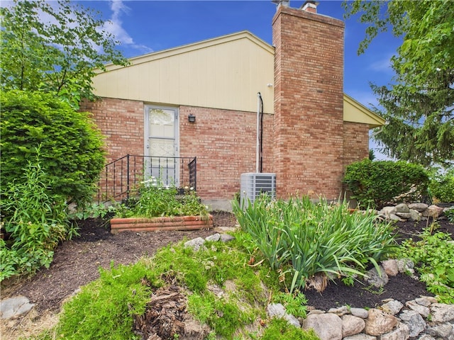 2120 Wyoming St, Dayton, OH 45410 - rear view of property featuring a chimney and brick siding