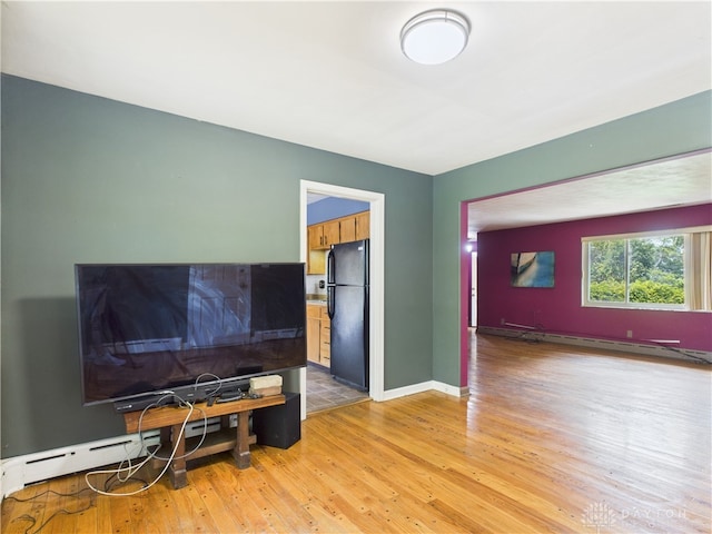 2120 Wyoming St, Dayton, OH 45410 - living area featuring a baseboard radiator and light wood-style floors