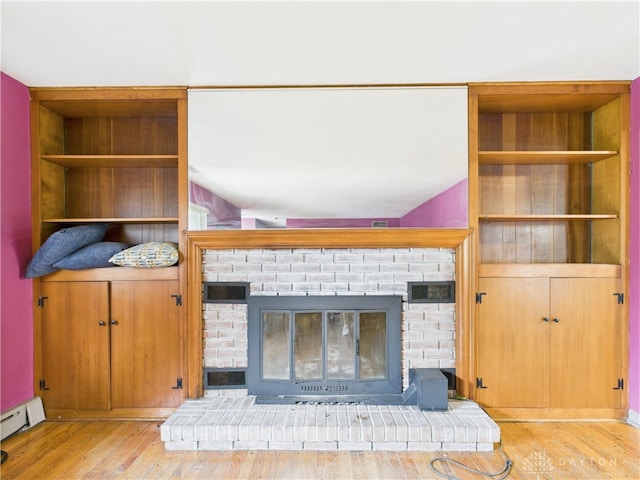 2120 Wyoming St, Dayton, OH 45410 - detailed view of a brick fireplace, wood finished floors, baseboard heating, and built in features